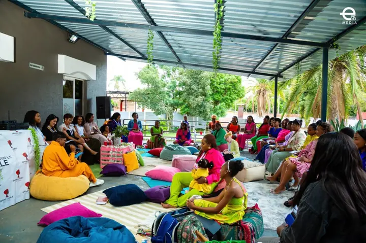 Women gathered in an outdoor circle at the 7th Edition Invaluable Woman Exhale Conference