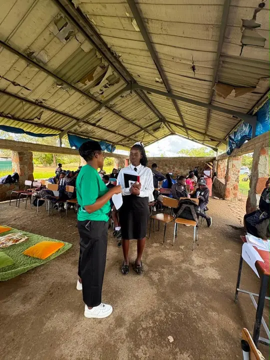 An ERO facilitator speaks with a student during the CTT Exhale Circle
