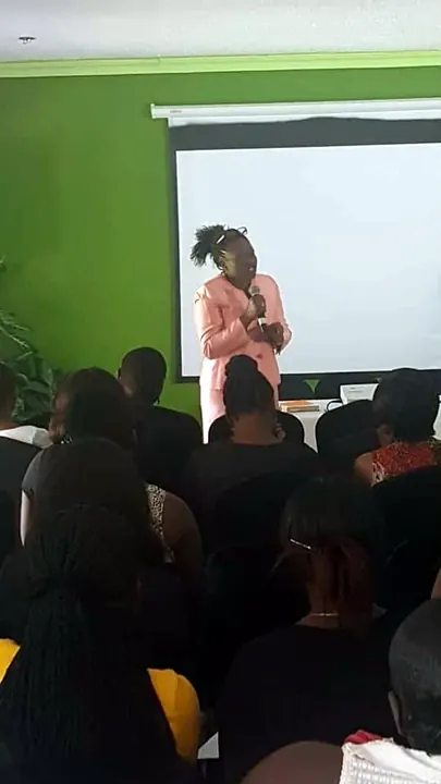 A facilitator addressing adults in a learning session